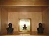 Group of bas-relief plaques and bookends depicting Theodore Roosevelt and his home.